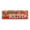 Greetings from Bolivia Vintage tin sign with Retro souvenirs or postcard templates on rust background. Vintage old paper