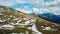 Greilkopf - Aerial view of hiker couple on rough alpine terrain in High Tauern National Park, Carinthia, Austria