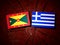 Grenada flag with Greek flag on a tree stump isolated