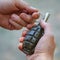 Grenade F-1 in male hands close-up