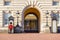 A Grenadier Guard on duty and two sentry boxes outside Buckingham Palace in London