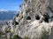 Grenoble, Bastille fortress. Mandrin caves in the mountains in front of the fort. Many entrances to caves in the rock. France