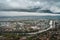 Grenoble cityscape, aerial view of Grenoble city with clouds and mountain background