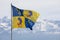 Grenoble, France, January 2019 : The Dauphine flag with snow covered mountains