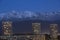 Grenoble, France, January 2019 : the three towers in front the belledonne mountains at night, ile verte neighbourhood