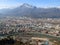 Grenoble. View of the city from above from a great height from the Bastille fortress. Isere river, roofs of houses, roads.