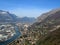 Grenoble. View of city from above from great height from Bastille fortress. Mountains with snow, Isere river, roofs of houses