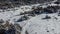 Greolieres ski slope and trees covered in snow, drone aerial view in winter