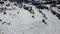 Greolieres ski slope and trees covered in snow, drone aerial view in winter