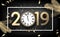 Grey 2019 happy New Year card with gold clock and fir.