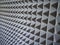 Grey acoustic foam rubber. Soundproof pyramids, full frame