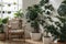 Grey armchair, indoor plants, monstera, palm trees. Urban jungle apartment. Biophilia design. Cozy tropical home garden. Home gard