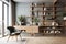 Grey barrel chair against of window and wooden shelving unit and cabinet on dark wall. Scandinavian style interior design of