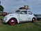 Grey Bug with Red Rims and Luggage on Luggage Rack