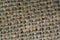 Grey burlap fabric closeup photo. Rough texture of natural burlap. Grunge textile for sack. Hemp or grass woven fabric