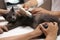 Grey cat having ultrasound scan in veterinary clinic