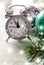 Grey Christmas alarm clock showing midnight, new years eve with decorations on white background