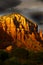 Grey clouds over red rock mountains