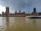 Grey clouds winter day sky over westminster abbey in city of london tourist boat ferry in the river thames pier gothic