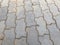 Grey color interlocking tiles pattern background tiles in the streets in which sand grouting