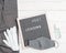 Grey colored Flatlay letter board with message text lockdown 2021. White protective gloves, medical masck for face