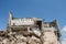 Grey concrete fragments of the building`s Foundation against a clear blue sky. Background