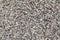 Grey crushed pebbles, background image. Crushed stone texture