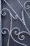 Grey curved wrought ironwork