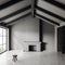 Grey empty room interior with fireplace, window and stool. Mockup wall