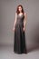 Grey evening dress. Beautiful model in bridesmaid dress  modern feminine look for an event. Women\'s fashion.