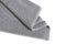 Grey folded terry towel isolated