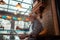 Grey-haired man reading news and drinking alcohol