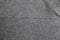 Grey herringbone tweed pattern, wool fabric background texture. interior material background.