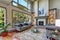 Grey interior of high vaulted ceiling family room.