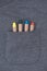 Grey male t-shirt with colorful crayons in pocket