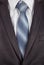 Grey men\'s business suit with a silk tie