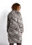 Grey midi fur coat trimmed rear view worn by woman with long curly red hair in on white