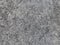 Grey natural raw seamless granite stone texture pattern background. Rough natural stone seamless texture surface with cracks, dent
