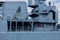 Grey navy battleship in a port in summertime