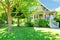 Grey old American house with summer landscape.