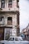 Grey oldtimer in front of aged facade in Havana, Cuba