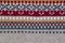 Grey, orange, dark red and beige realistic knitting pattern