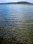 Grey pebbles under clear water of Wigry Lake