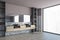 Grey and pink bathroom with black sinks, grey tiled floor and window