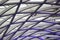 Grey and purple pipes forming an abstract pattern.