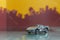 Grey racer car toy selective focus on blur city background