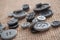 grey sewing buttons on hessian texture background