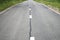 Grey shabby car asphalt road with white dividing lines