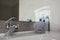 Grey shower puff and cosmetic products on washbasin in bathroom