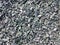 Grey shredded recycled pieces of tire or background